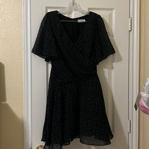 Black polka dotted wrap dress